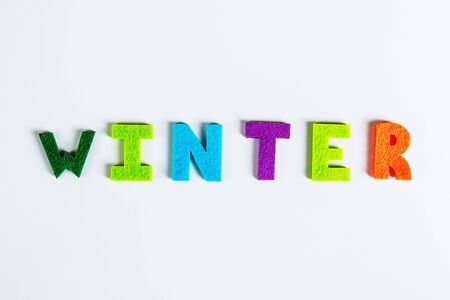 The word WINTER is written in multicolored letters. Winter time concept.の写真素材