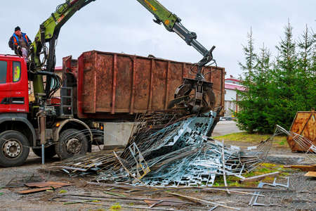 Skutec, Czech Republic, 21 November 2019: A grapple truck loads scrap industrial metal for recyclingのeditorial素材