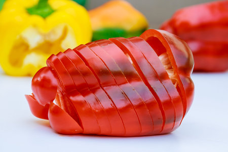 sliced red pepper on a white background