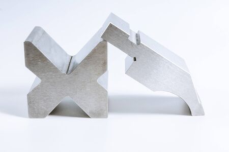 Sheet metal bending tool and equipment isolated on a white background. Special Bending machine Forming mold punch and die. Press brake tools, bend tools, press brake punch and die.の写真素材
