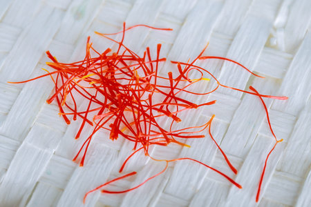 Many threads crocus sativus isolated on white background. The most expensive spice.