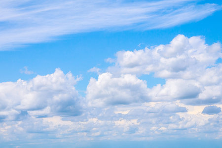 Blue sky with white clouds on a clear sunny day.の写真素材