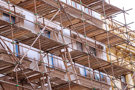 PRAGUE, CZECH REPUBLIC - April 8, 2019: Old building in the center of Prague with scaffolding. Restoration of the facade.のeditorial素材