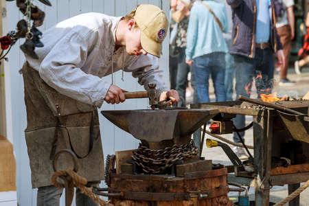 PRAGUE, CZECH REPUBLIC - April 8, 2019: Furnace for blacksmiths on coal. Equipment for steel forging. Metal forging street show in the center of Prague.のeditorial素材