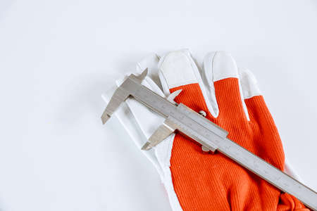 Measuring inner diameter, outer diameter, length with a caliper on a white background. Measurement accuracy.の写真素材