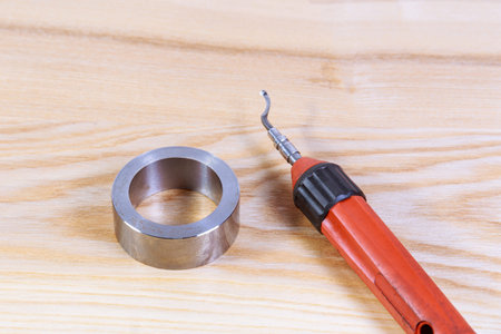 The process of deburring metal. Deburring tool for metal, wood, aluminum, copper and plastic.