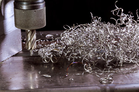 Portable magnetic drill. Portable mag drill makes deep holes in solid steel or plates. Metal shavings.の写真素材