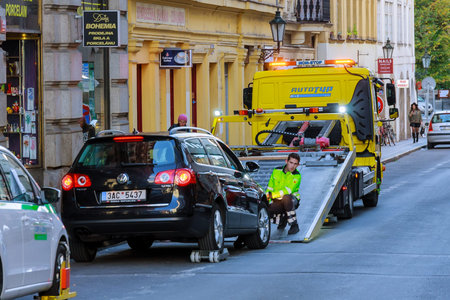 Prague, Czech Republic - October 4, 2020: The car is loaded on an evacuation tow truck in Prague
