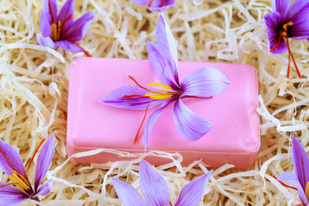Saffron soap with saffron stigma. Crocus flowers. Saffron soap and cream. The use of saffron in cosmetology. Natural cosmetic.の写真素材