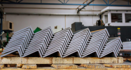 The sheet metal product is folded on wooden pallets after processing on a bending machine.