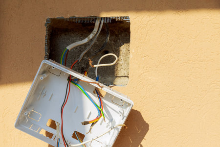 Shield With electrodes suspended on the work wall. Installation of an electric board, a package...