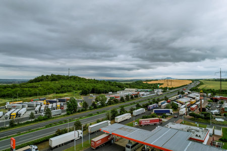 1 July 2021 Czech Republic Sirejovice: Parking for trucks and cars and a gas station near the highway. Rest for drivers. view from above.のeditorial素材
