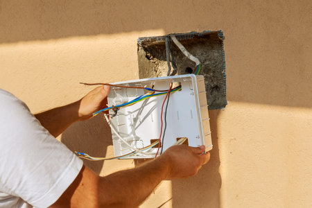 To connect the wires to the mains, the electrician installs an electrical panel. Assembly of an...