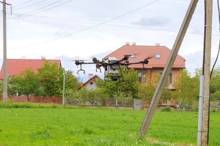 Agrodron sprays a field in the countryside.の写真素材