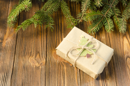 gift box, fir on a wooden backgroundの写真素材