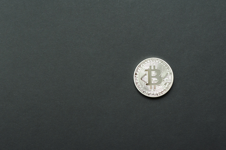 Silver bitcoin on gray backgroundの写真素材