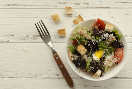 Salad, caesar  on white wooden background and copy spaceの写真素材