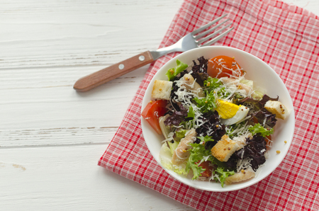 Salad, caesar  on white wooden background and copy spaceの写真素材