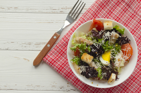Salad, caesar  on white wooden background and copy spaceの写真素材