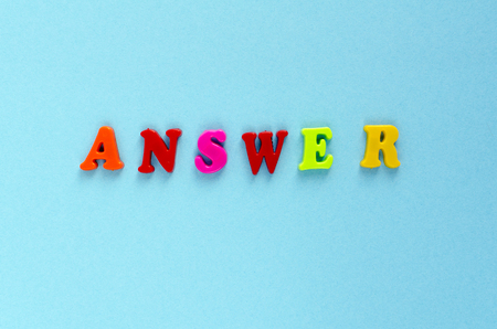 word "answer" of plastic magnetic letters on blue backgroundの写真素材