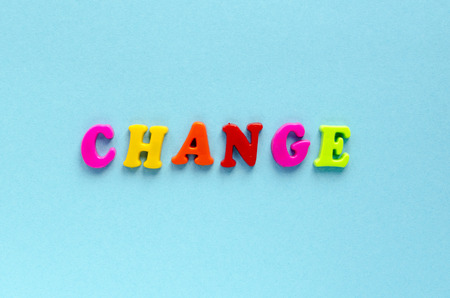 word "change" of plastic magnetic letters on blue backgroundの写真素材