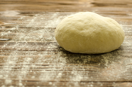 Dough on wooden backgroundの写真素材