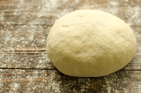 Dough on wooden backgroundの写真素材