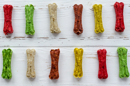 multicolored chewing bones with rice. dog food.の写真素材