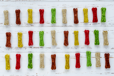 multicolored chewing bones with rice. dog food.の写真素材