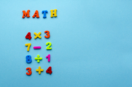 mathematical actions on blue paper backgroundの写真素材