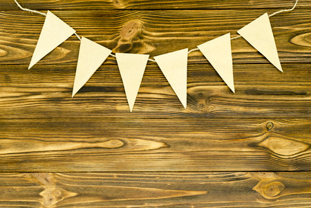 craft paper  flags  party garland  on wooden backgroundの写真素材