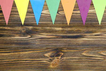 paper  flags  party garland  on wooden backgroundの写真素材