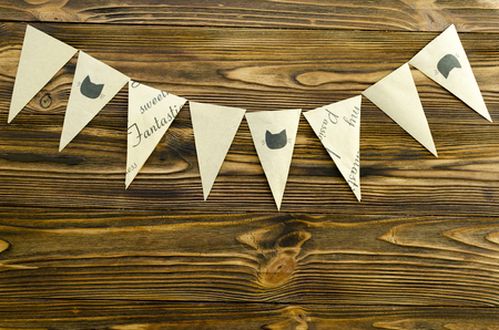 craft paper  flags  party garland  on wooden backgroundの写真素材