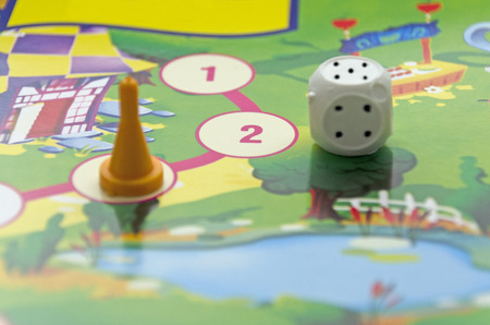 table game for children: chips, dice and play boardの写真素材