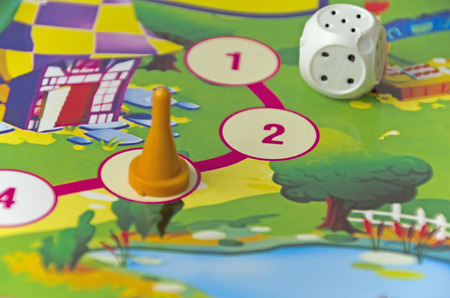 table game for children: chips, dice and play boardの写真素材
