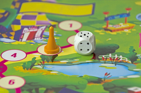 table game for children: chips, dice and play boardの写真素材