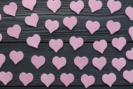 Paper pink hearts on grey wooden backgroundの写真素材