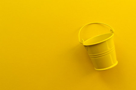 empty toy bucket on paper backgroundの写真素材