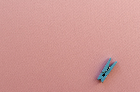 clothes pin on paper backgroundの写真素材