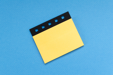 blank post it sticker on blue backgroundの写真素材