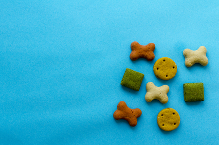 biscuits for dogs on blue paper backgroundの写真素材