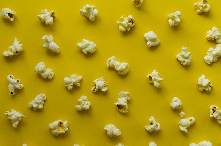 popcorn  on yellow paper backgroundの写真素材