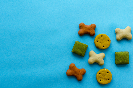 biscuits for dogs on blue paper backgroundの写真素材