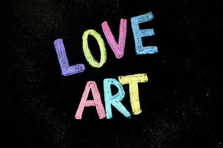 colored text love art on blackboardの写真素材