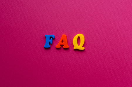 abbreviation FAQ from plastic magnetic letters on pink backgroundの写真素材