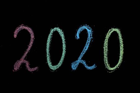 colored chalk drawn numbers on blackboardの写真素材