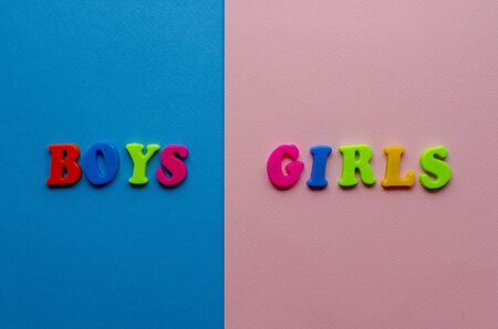 words from colored plastic words on paper backgroundの写真素材