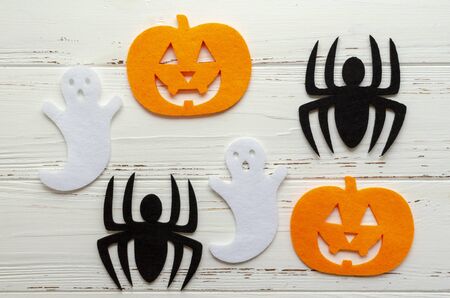 felt pumpking, ghost, spider on wooden backgroundの写真素材
