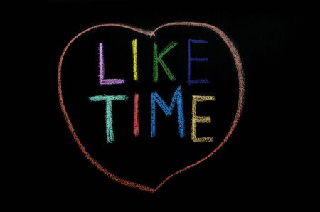 hand drawn colored words "liketime" on blackboardの写真素材