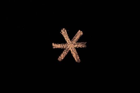 chalk drawn asterisk on blackboardの写真素材